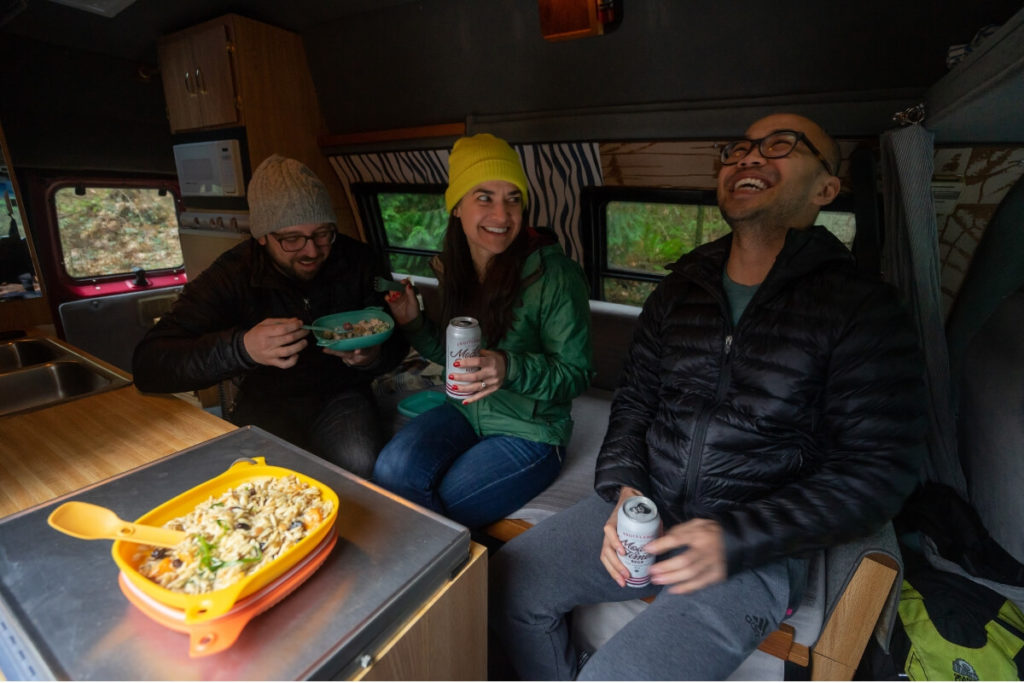 People sitting in car and beer and food