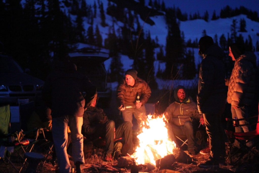 Group of people in front of campfire