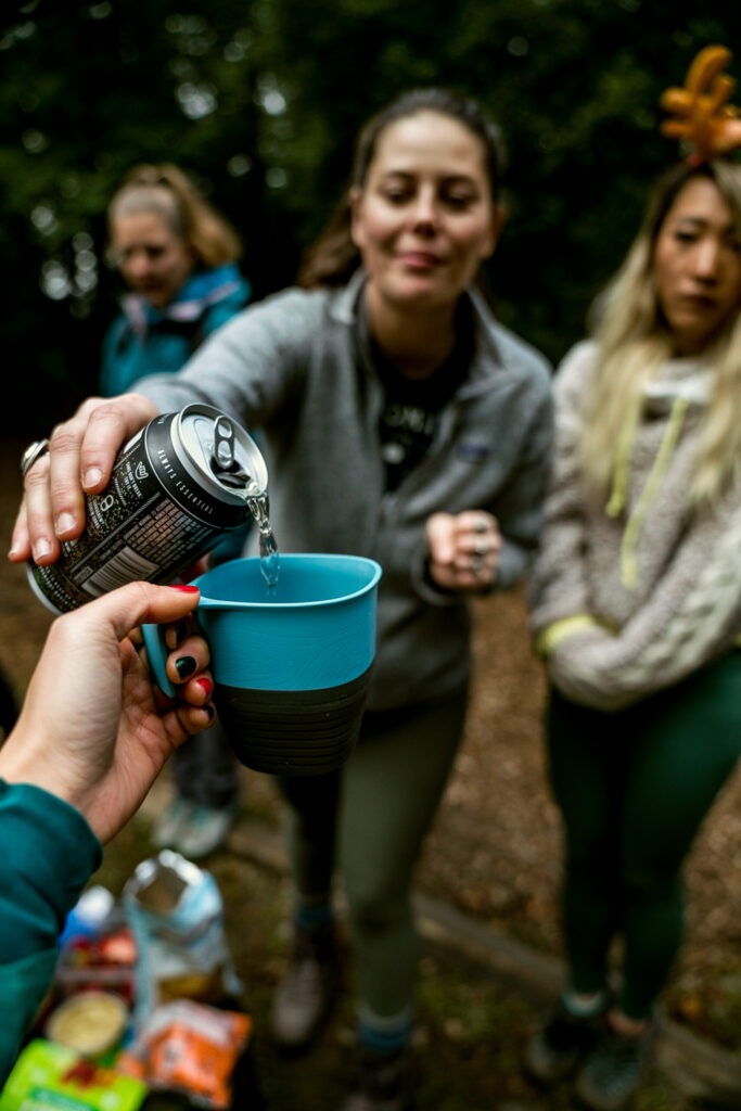 Pouring backcountry cocktail into UCO Camp Cup